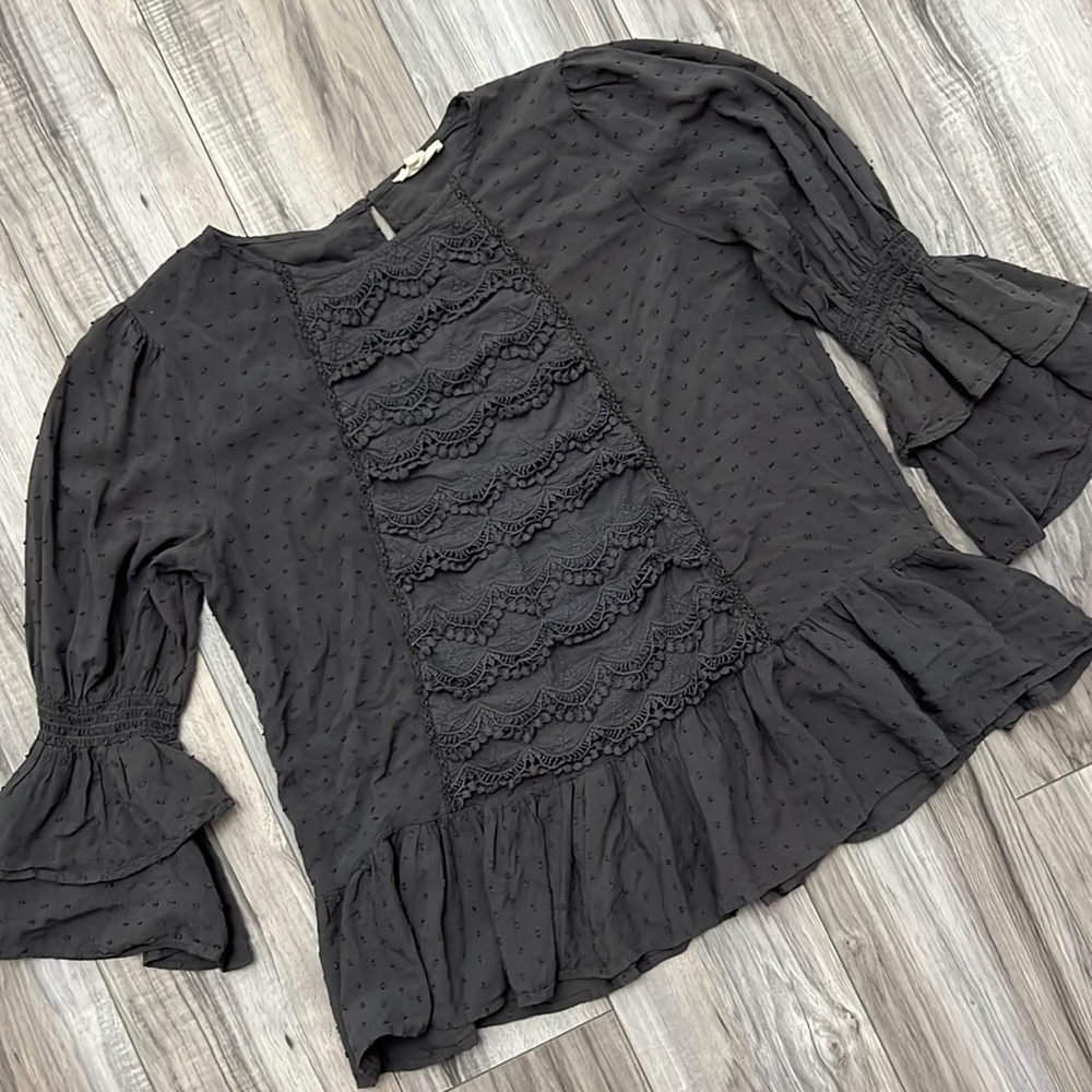 Dark gray flowy top.